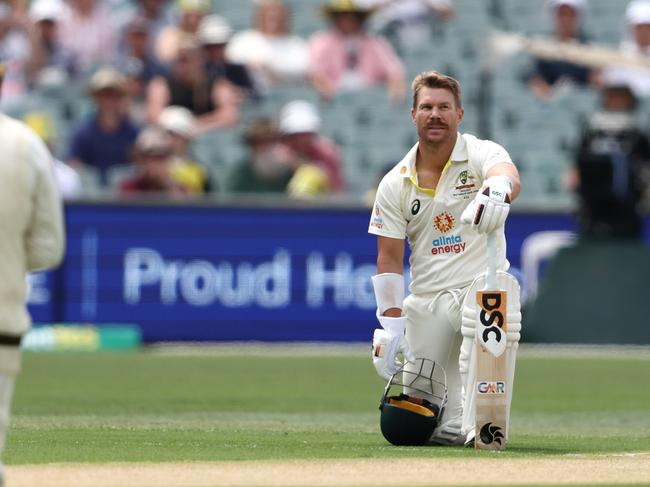 ADELAIDE, AUSTRALIA - DECEMBER 08: David Warner and Usman Khawaja of Australia take a knee befre the start of play on day one of the Second Test Match in the series between Australia and the West Indies at Adelaide Oval on December 08, 2022 in Adelaide, Australia. (Photo by Matt King/Getty Images)