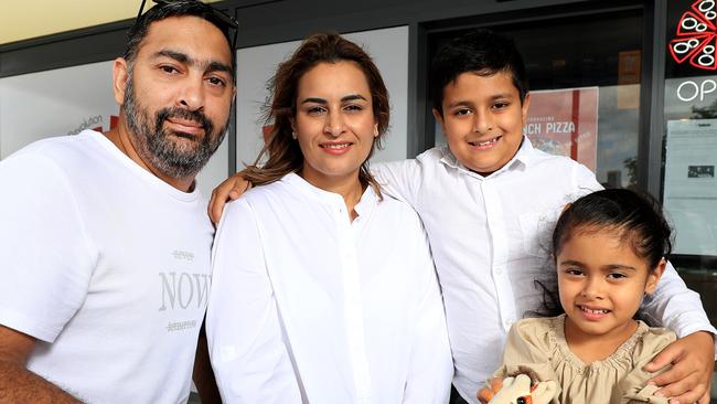 Japjit (Jamie) Rajpal (owner) with wife Mandy Kaur and children Guransh (9) and Gurmehar (4). Picture Scott Powick Newscorp