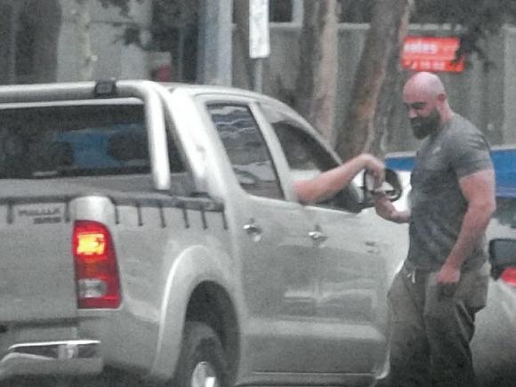 The ICAC has released images purporting to show a meeting with allegedly corrupt bureaucrats. Hassan Alameddine is seated in vehicle on Phillip St Parramatta outside the Octagon Building. Alexandre Dubios is seen handing him a piece of white paper.