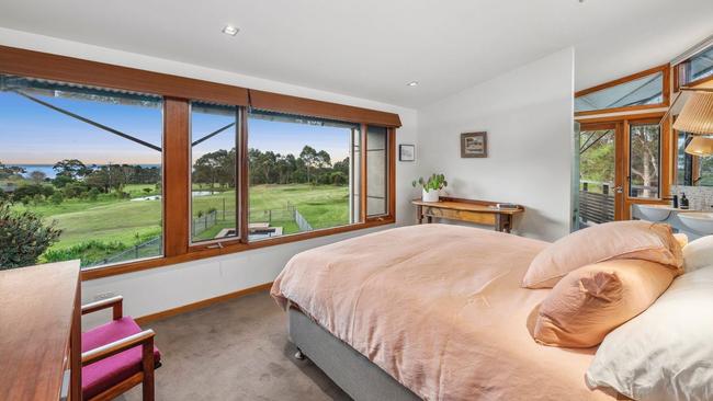 Wake up to bay views in the main bedroom suite.