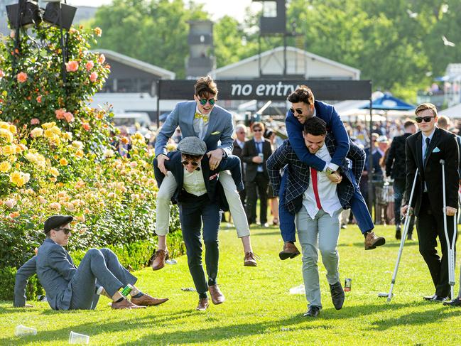 Punters race home after a long day at Flemington in 2019.