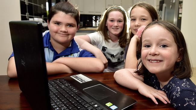 Students Josie, 6, Anna, 8 and Grace Taylor, 10 with Isabella Dolan, 11 are learning from home during term 2. PICTURE: MATT TAYLOR.