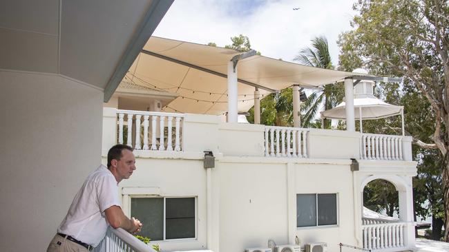 Reef House manager Wayne Harris at the neighbouring Melaleuca Hotel, showing how close the rooftop bar will be. Picture: Brian Cassey