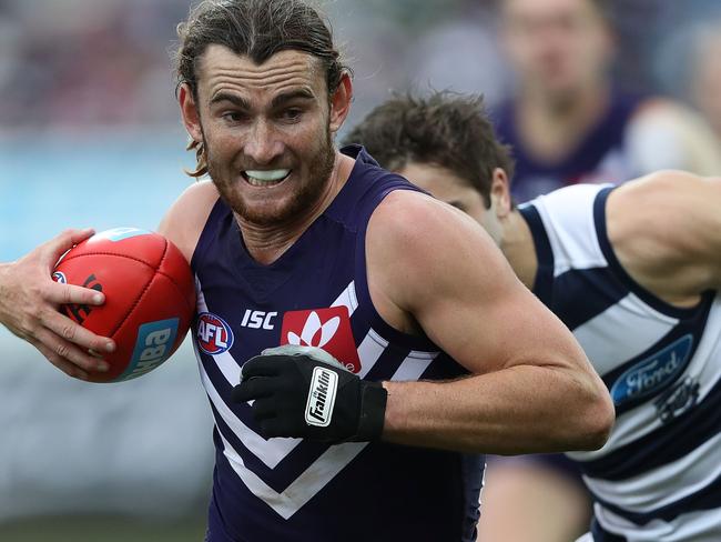 GEELONG, AUSTRALIA - JUNE 25: Connor Blakely of the Dockers runs with the ball during the round 14 AFL match between the Geelong Cats and the Fremantle Dockers at Simonds Stadium on June 25, 2017 in Geelong, Australia.  (Photo by Robert Cianflone/Getty Images)