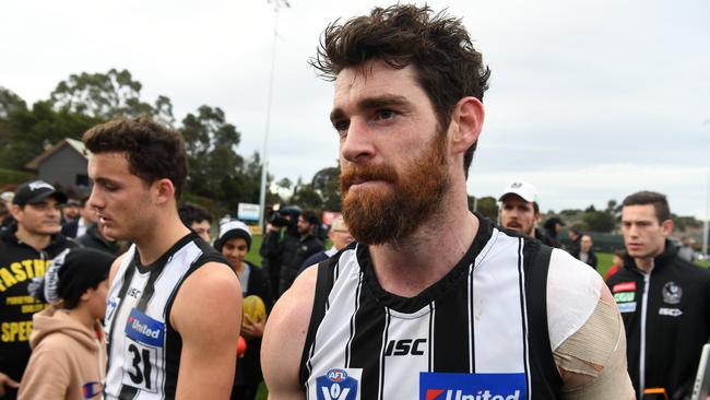 Goldsack leaves the field after the round 21 VFL match against Richmond – his last game in Magpies colours. Picture: AAP/James Ross