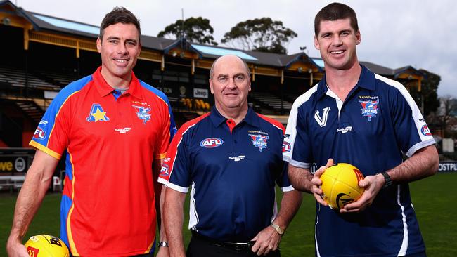 Ted Whitten Jnr with All Stars captain Matthew Richardson and Victoria captain Jonathan Brown.