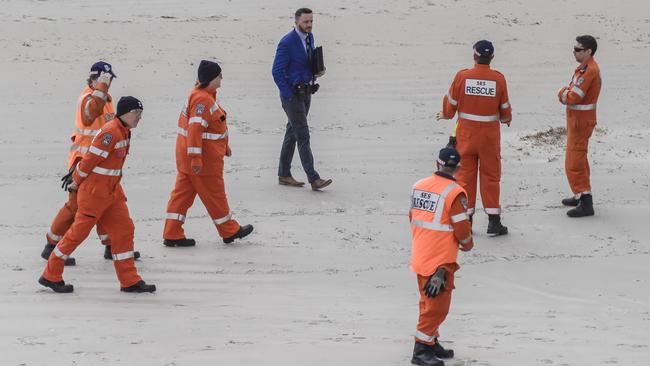 SES volunteers searching West Beach after the man’s body was found.Picture: NCA NewsWire / Roy VanDerVegt