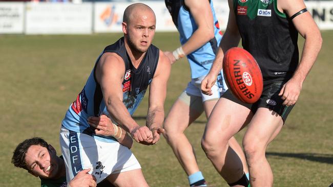 EDFL footy: Greenvale V Aberfeldie. Greenvales Paul Lennie gets the grip on Aberfeldies Mark Lynch