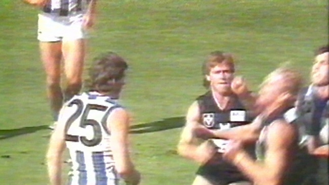 Alastair Clarkson hits Ian Aitken in the ‘Battle of Britain’ clash between Carlton and North Melbourne in 1987.