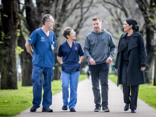 Dale Atkin with the medical professionals from the Alfred hospital who worked closely with him. Picture: Jake Nowakowski.