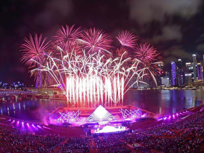 Singapore awaits 2020 with curtain-raiser fireworks by Star Island as revellers join in the biggest countdown celebration at Marina Bay. Picture: Getty