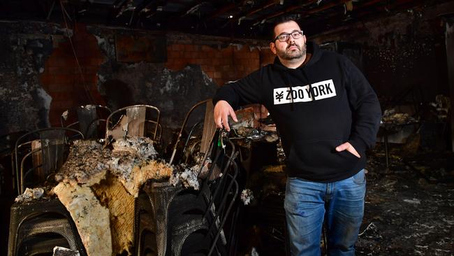 Zak Kartabani inside the burnt-out store on July 28. Picture: AAP/Keryn Stevens