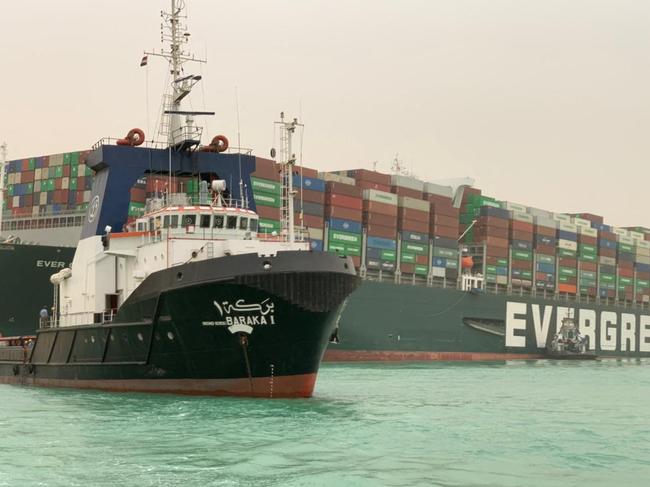 A giant container ship ran aground in the Suez Canal after a gust of wind blew it off course. Picture: Marina Passos/AFP