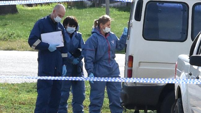 Forensic police examine the murder scene. Picture: Kylie Else