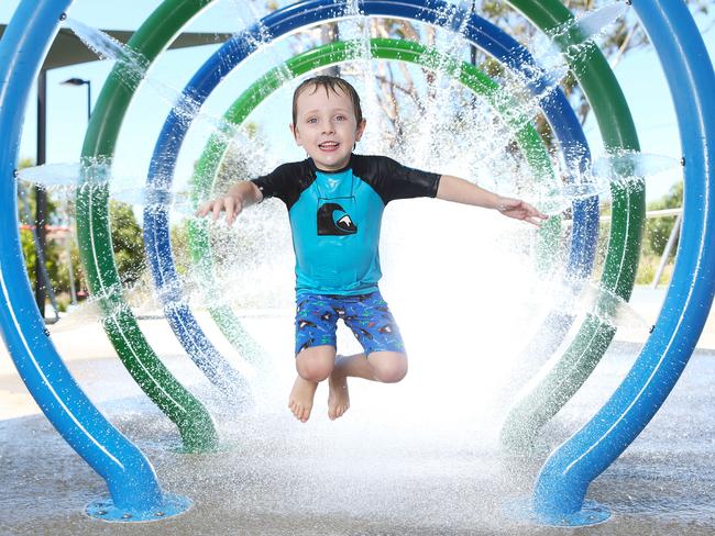 Owen Pender  plays in a water park in Blacktown, where the temperature is due to hit 42 on Friday.