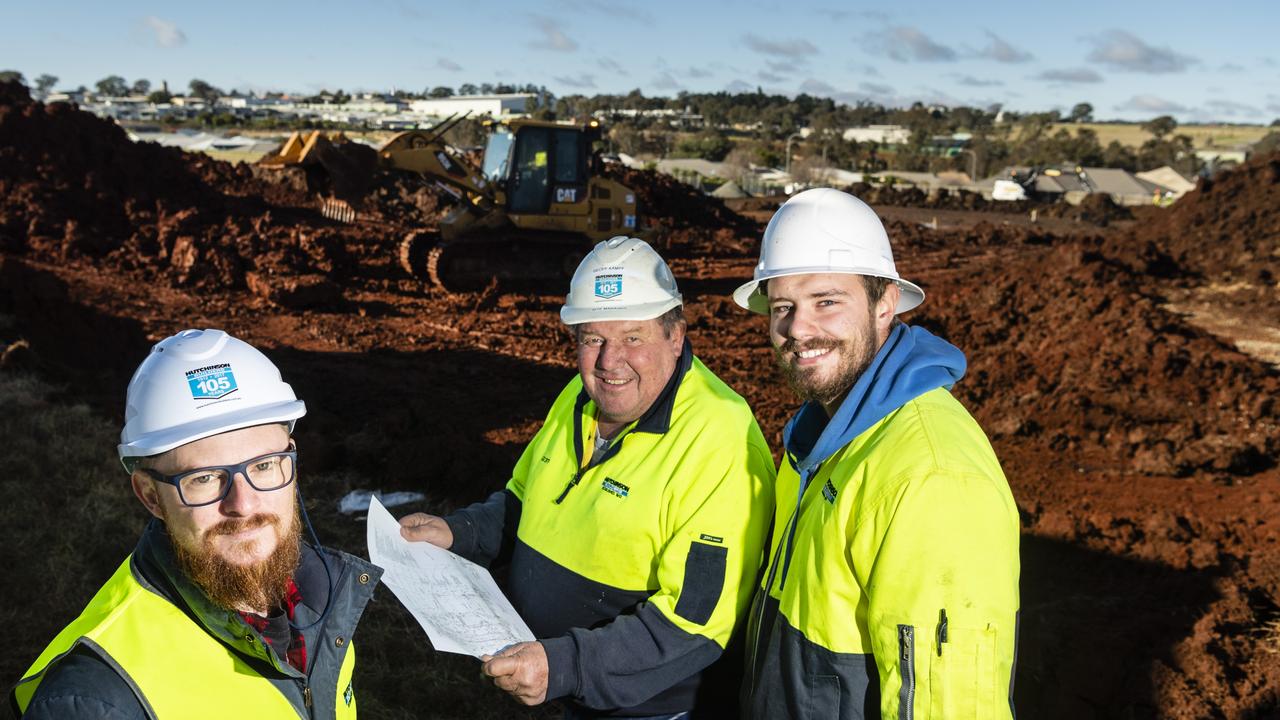 On site are (from left) Hutchinson Builders construction manager Nick Linnan, site manager Geoff Kampf and fourth year apprentice Sean McDonnell at the Greenwattle St construction site of a new medical centre, pharmacy and childcare centre in Glenvale, Friday, July 8, 2022. Picture: Kevin Farmer