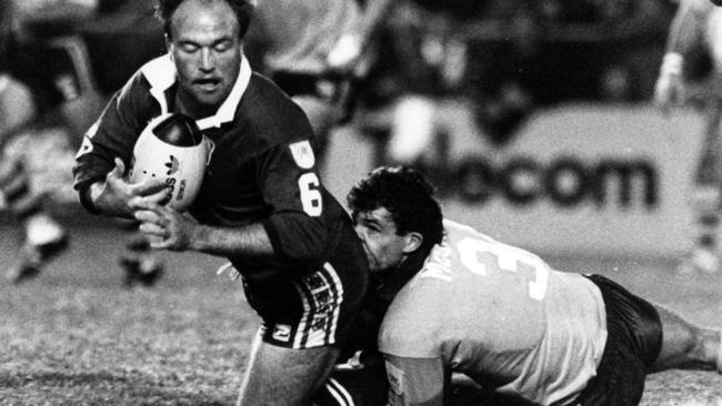 Wally Lewis is brought down by Mark McGaw in Game 2 of the 1987 series.