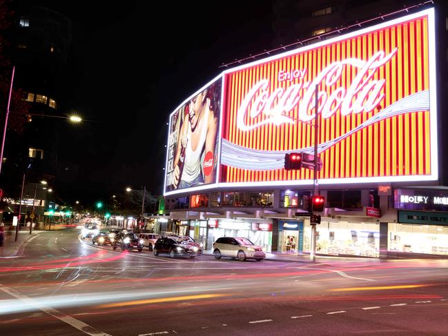 The Coke sign on Darlinghurst Rd recently has a facelift and the rest of the district is not far behind as new Kings Cross takes shape. Picture: Damian Shaw