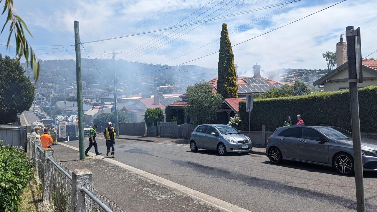 Smoke was seen billowing out of the roof of 24 Eardley St, South Launceston. Picture: Alex Treacy