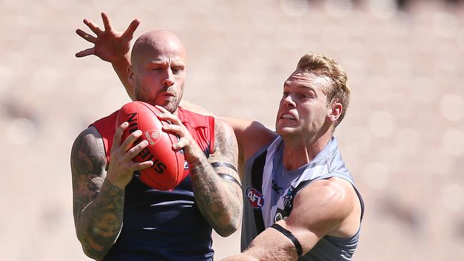 Jack Watts pressures former teammate Nathan Jones in Round 1. Picture: Michael Dodge/Getty Images)