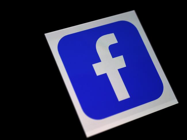 In this file illustration photo taken on March 25, 2020, a Facebook App logo is displayed on a smartphone in Arlington, Virginia. (Photo by Olivier DOULIERY / AFP)