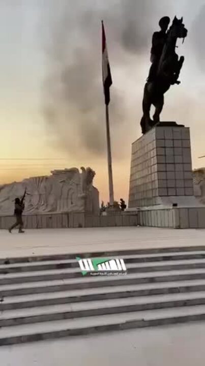 Syrian Rebels Remove Regime Flag From Aleppo Monument