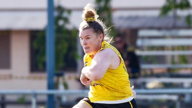 Nightcliff captain Hannah Turnbull boots the ball forward in the 2023-24 NTFL season. Picture: Celina Whan / AFLNT Media