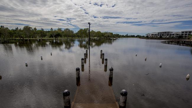 Floodwater due to heavy rain over the past few days is finally receding at Emerald Lakes, Carrara. Picture: Jerad Williams