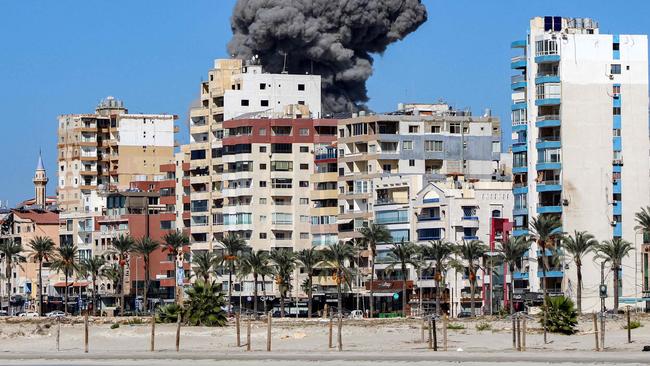 A large smoke plume rises following the strike. Picture: AFP.