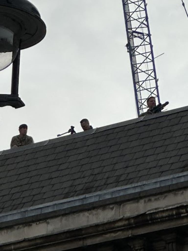 The snipers appeared on the rooftops above the crowd shortly after 7am. Picture: Bronte Coy