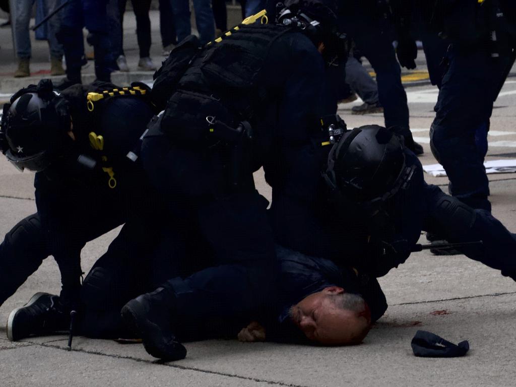 Police detain protesters calling for electoral reforms and a boycott of the Chinese Communist Party in Hong Kong. Picture: AP Photo/Ng Han Guan