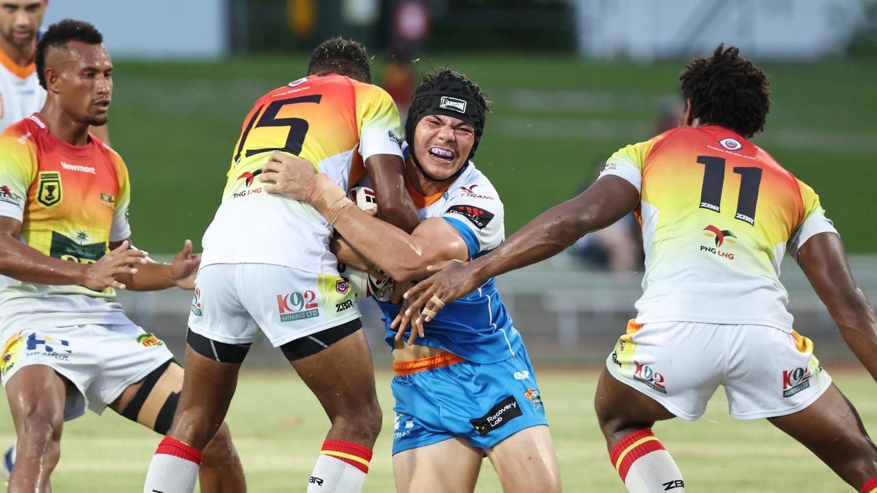 Pride's Braithan Robertson-Ketchell gets hit hard in the Queensland Rugby League (QRL) pre season match between the Northern Pride and the PNG Hunters, held at Barlow Park. Picture: Brendan Radke