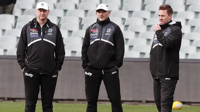 Ken Hinkley with two of his assistants — 2004 premiership players Brett Montgomery and Jarrad Schofield. Picture: Sarah Reed