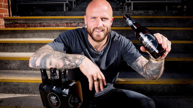 Melbourne captain Nathan Jones celebrates the Demons’ first finals appearance for more than a decade by pouring a Carlton Zero beer. Picture: Jake Nowakowski