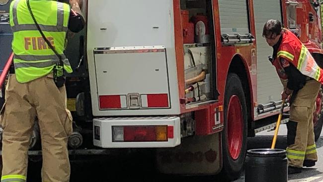 Fire and Rescue Lismore firefighters clean up a diesel spill on the Bruxner Hwy. File Photo: Alison Paterson