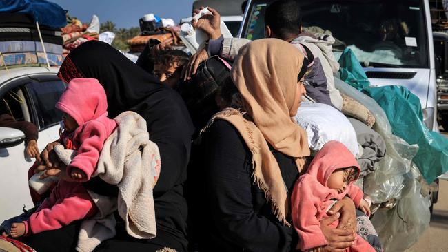 Palestinian families fleeing the city on the coastal road leading to Rafah, amid ongoing battles between Israel and the Palestinian militant group Hamas, of which around 20 per cent only has been eliminated. Picture: AFP