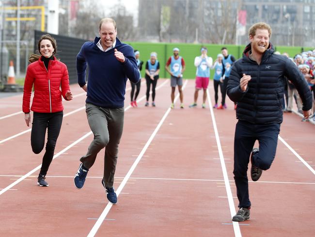 Britain's Prince William, second left, Kate, the Duchess of Cambridge, left, and Prince Harry take part in a relay race, during a training event to promote the charity Heads Together, at the Queen Elizabeth II Park in London, Sunday, Feb. 5, 2017. (AP Photo/Alastair Grant, Pool)