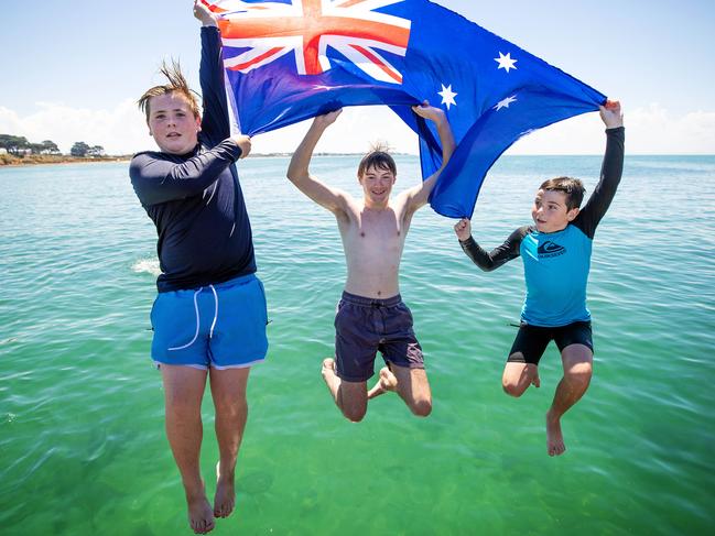 Phoenix, 13, Thomas, 15, and Jasper, 11, at St Leonards Beach. Picture: Mark Stewart