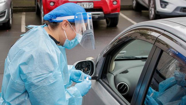 A health worker conducts a test at a COVID-19 coronavirus testing centre in Auckland. Picture: AFP.