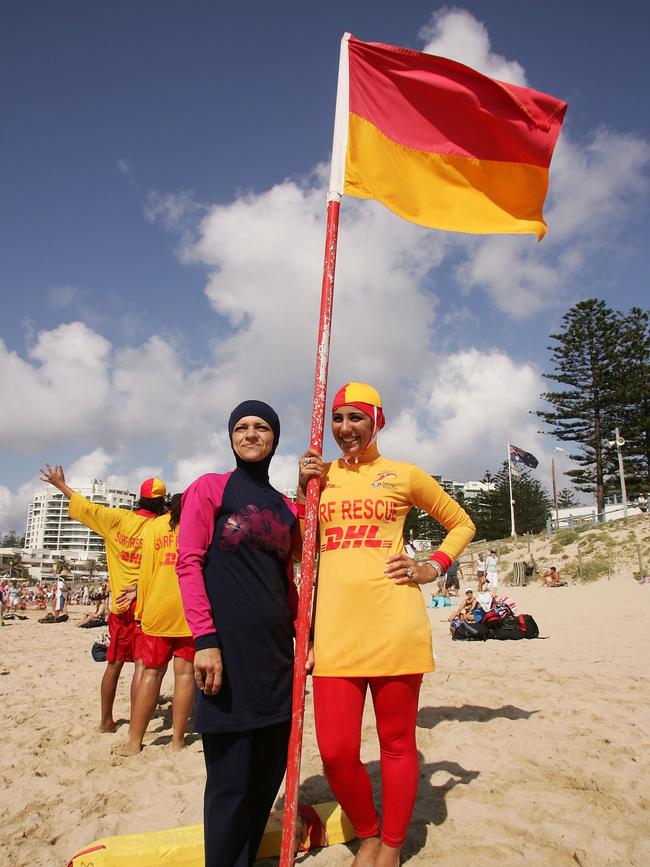 Burqini designer Aheda Zanetti, left, poses with Mecca Laa Laa wearing a burqini on her first surf lifesaving patrol at North Cronulla Beach in February 2007. Picture: Getty Images