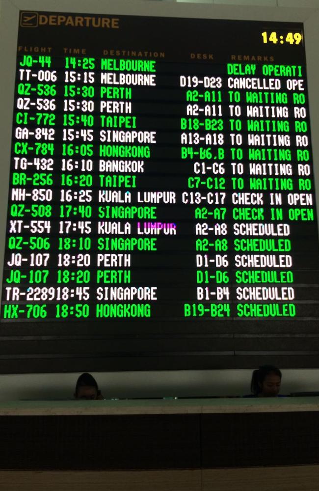 The departure board at Bali’s Denpasar Airport showing flight cancellations. Picture by Raiza Andini