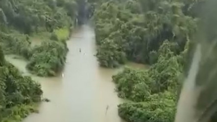 Residents risk it all as floodwaters rise in Far North Queensland. Picture: Facebook.