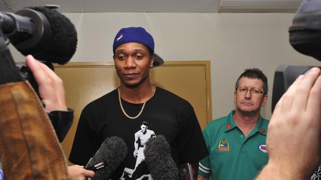 Townsville Crocodiles import Rosell Ellis fronts the media yesterday afternoon with club chief executive Ian Smythe in the background. Ellis was fined $750 by the NBL for his part in a melee at The Swamp last Saturday during the clash against Cairns.