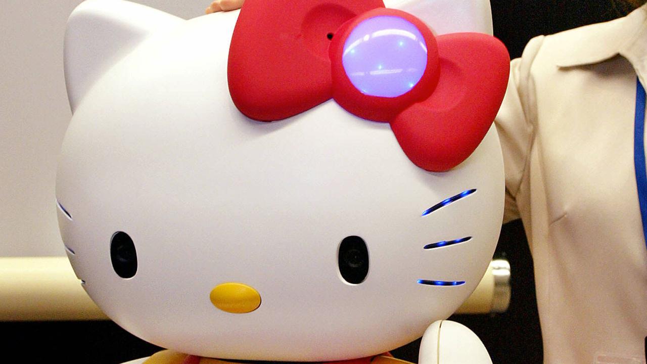 Computer company NEC and robotic venture Business Design Laboratory unveils in Tokyo, 12 Jul 2004 the prototype model of communication robot "Hello Kitty Robo", which is able to recognize human voices, faces, and speak thousands of phrases. AFP PicYoshikazu/Tsuno technology