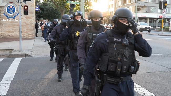 Police leave Maroubra to prepared for one of the raids. NSW Police