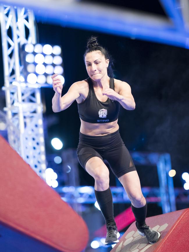 Susie Q competes in Ninja Warrior.