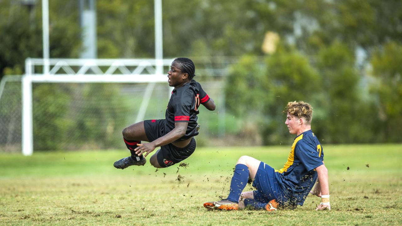 Toowoomba's Menphys-Reyne Smith tackles Christopher Morseray from St Joseph's Gregory Terrace in the First XI Football (soccer) match between St Joseph's Gregory Terrace and Toowoomba Grammar School at Tennyson, Saturday, July 25, 2020 - Picture: Renae Droop