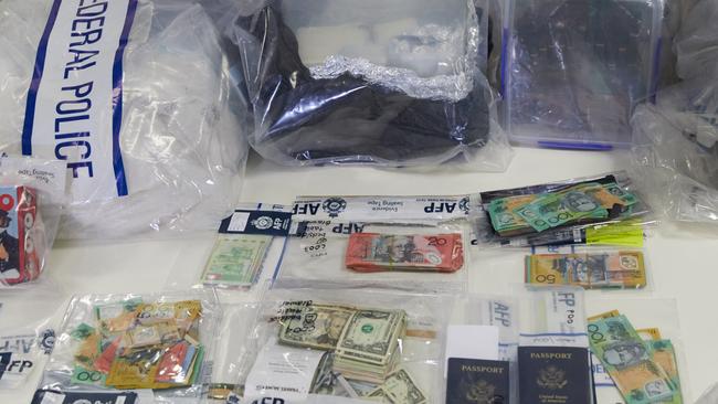 Drugs, passports and money seized as part of last week’s joint operation. Picture: Erik Anderson