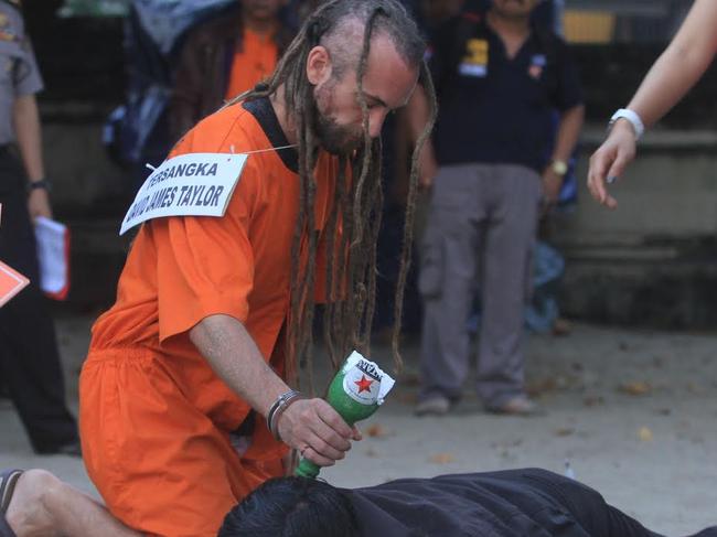 David Taylor during the reenactment for the murder of Bali police officer Wayan Sudarsa on Kuta Beach. Sara and David Taylor were arrested as suspected involved on Police murder on August 17. Pic: Rizal Fanany