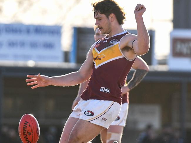 Jarred Coutts kicks a goal for Lower Plenty. Picture: Nathan McNeill